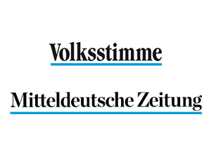 Logo showing two German newspapers: 'Volksstimme' on top and 'Mitteldeutsche Zeitung' below, each with a blue underline.